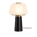 **Lampa stołowa z szklanym kloszem i elegancką podstawą**