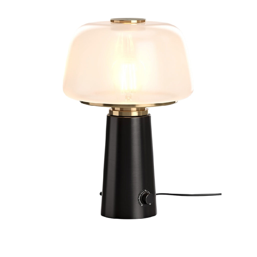 **Lampa stołowa z szklanym kloszem i elegancką podstawą**